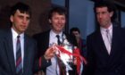 John Hewitt (left), manager Alex Ferguson and Billy Stark celebrate with the Scottish Cup in 1986.