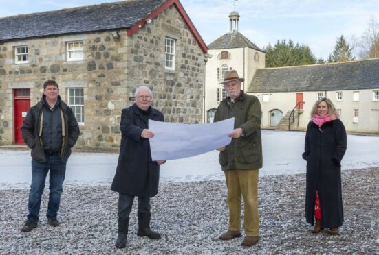 Aberdeenshire Council Buchan area committee chairman Norman Smith, centre left, and infrastructure services committee chairman Peter Argyle study the Accessible Aden plans flanked by Aden project officer Neil Shirran and Buchan area manager Amanda Roe.