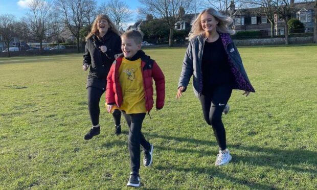 Archie supporters Angie, Ethan and Jodie Taylor taking part in Marathon March.