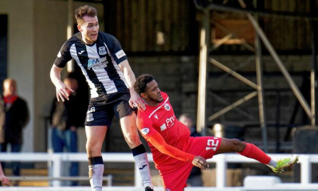 Jevan Anderson in action for Elgin City against Stirling Albion's Akeel Francis.