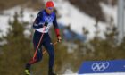Andrew Young, of Britain, competes during the men's 15km classic cross-country skiing competition.