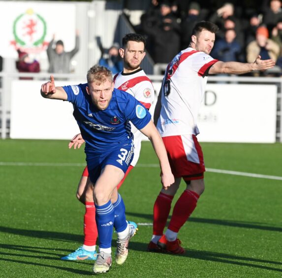 Harry Milne wheels away after giving Cove Rangers the lead