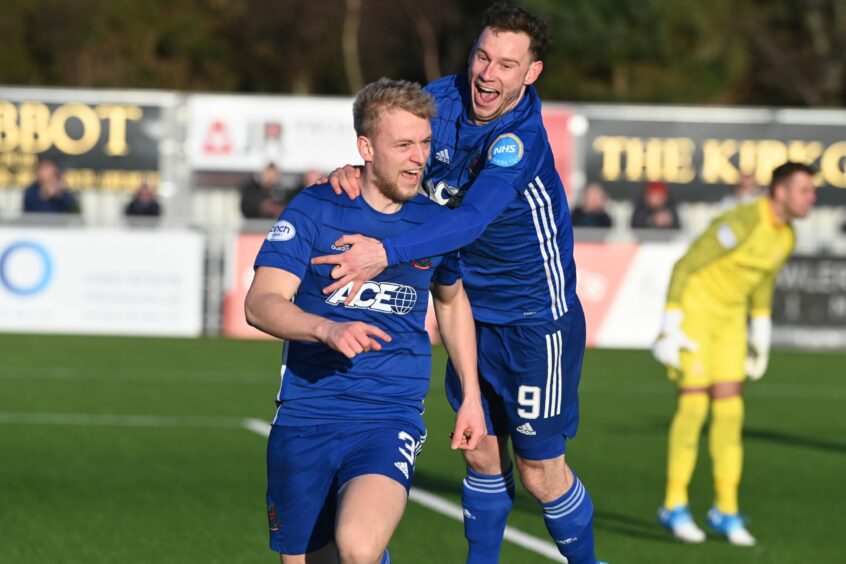 Goalscorer Harry Milne is congratulated by Mitch Megginson after giving Cove Rangers the lead