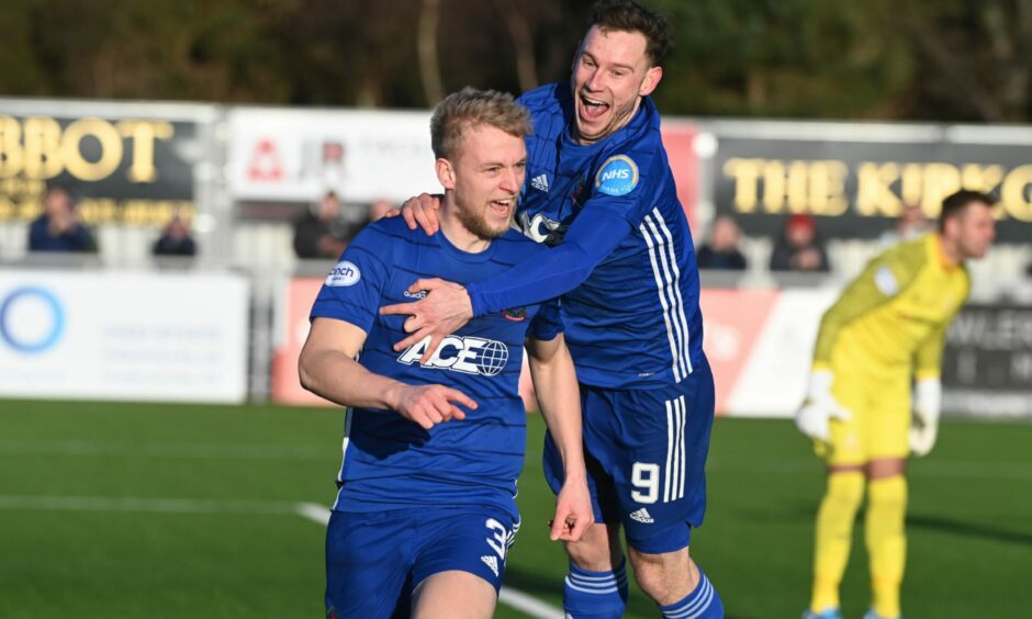 Goalscorer Harry Milne is congratulated by Mitch Megginson after giving Cove Rangers the lead