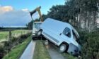 Courier van forced off road due to high winds and icy conditions had to be lifted using a crane. Supplied by Pegasus Couriers.