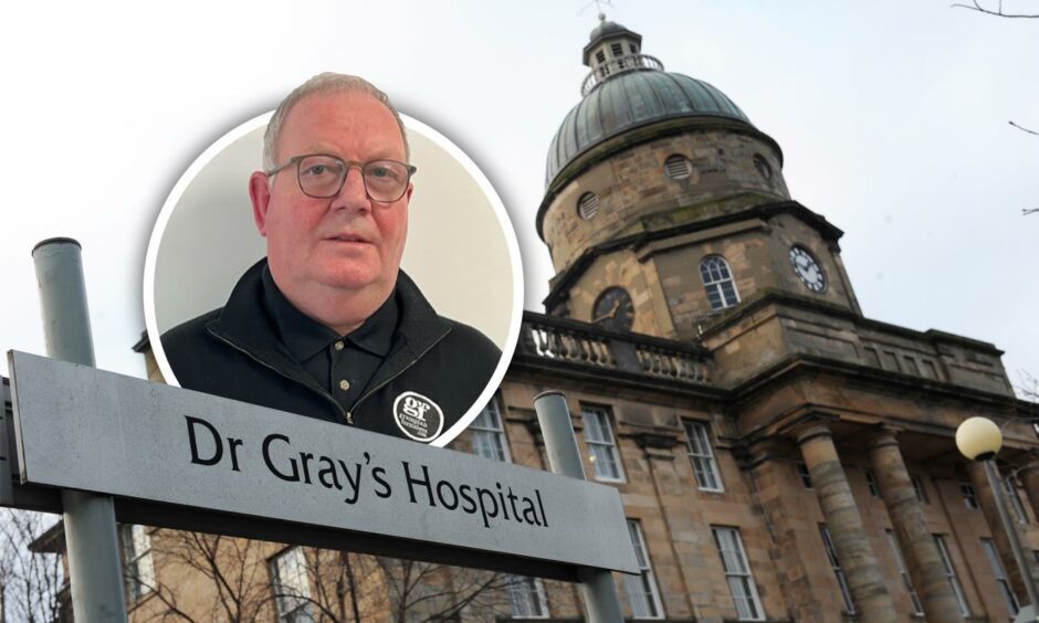 David Stewart next to Dr Gray's hospital in Elgin