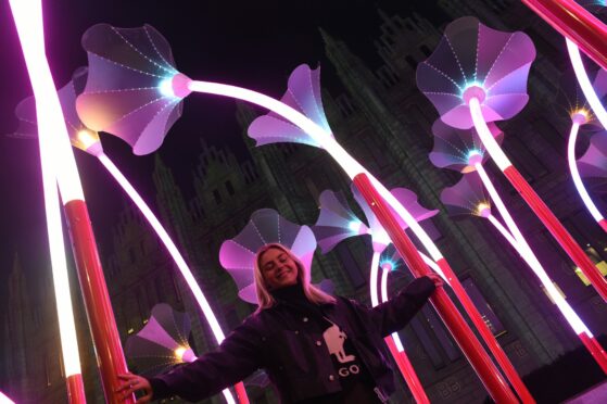 Spectra Aberdeen: Trumpet Flowers by Amigo and Amigo on Broad Street is an immersive jungle of light, colour and sound. Pictured: Caitlin Kurtto. Picture by Paul Glendell/DCT Media