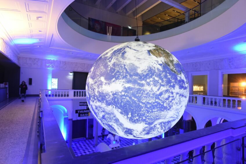 Gaia is a spectacular floating planet Earth in the Sculpture Court of Aberdeen Art Gallery.