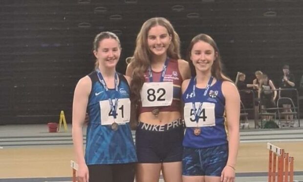 Emma Barclay, centre, took gold in the 200m at the Scottish Student indoor track and field championships