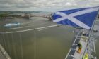 Alex Salmond watches on with Dominico Comisso, captain of the ‘Scottish Viking’ Norfolkline ship, as it arrives in Rosyth as part of its route to Zeebrugge.