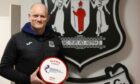 Elgin City manager Gavin Price with his manager of the month award for January.