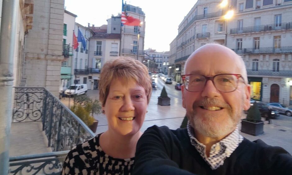 Anne and Colin Macaulay on a city centre balcony. 