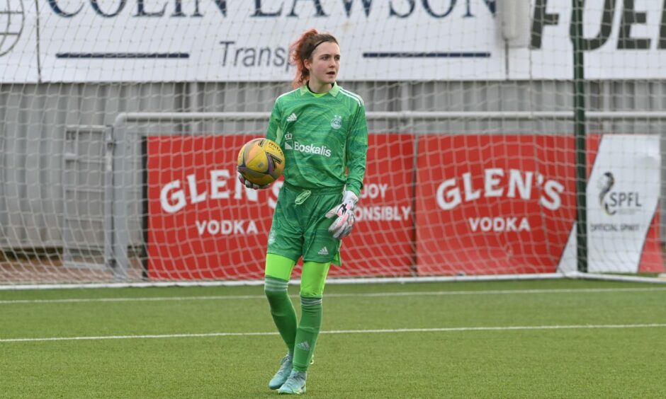 Aaliyah-Jay Meach, Aberdeen Women's only senior goalkeeper, holding the ball on the pitch