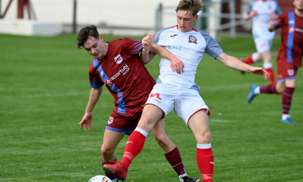 Dylan Stuart, right, in action for Turriff United