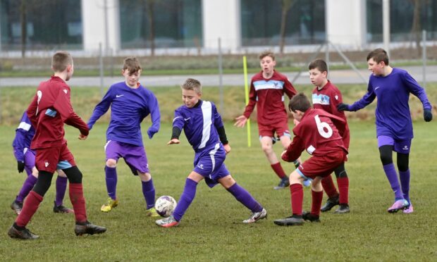 St Machar Academy First Year (purple) v Harlaw Academy First Year (maroon). Pictures by Kath Flannery