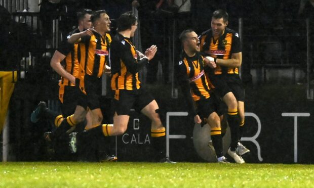 Greg Buchan, second from right, celebrates scoring Huntly's first goal against Banks o' Dee in the Aberdeenshire Shield final