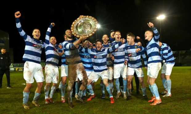 The Banks o' Dee players celebrate their Aberdeenshire Shield success
