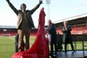 Sir Alex Ferguson unveils his statue at Pittodrie, the home of Aberdeen FC alongside him is Dons chairman Dave Cormack.  
Picture by Kami Thomson / DCT