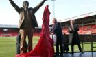 Sir Alex Ferguson unveils his statue at Pittodrie, the home of Aberdeen FC alongside him is Dons chairman Dave Cormack.  
Picture by Kami Thomson / DCT