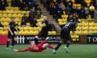 Aberdeen's Lewis Ferguson goes down in the box looking for a penalty against Livingston.