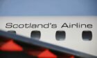 A close-up of the side of a Loganair plane.