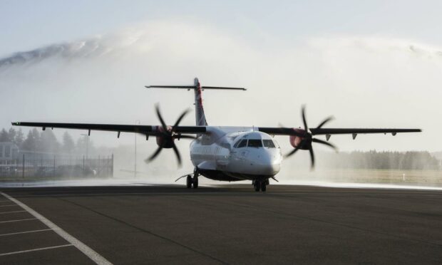 Jets of water celebrate Loganair's 60th year as one of its aircraft prepares for take-off.