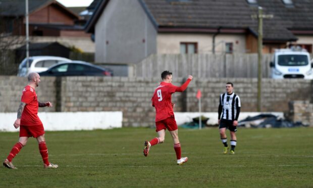 Ryan Farquhar, centre, celebrates his goal for Lossiemouth against Fraserburgh