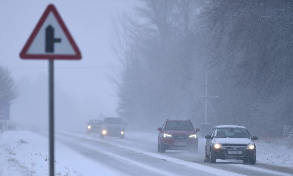 Cars driving through snow