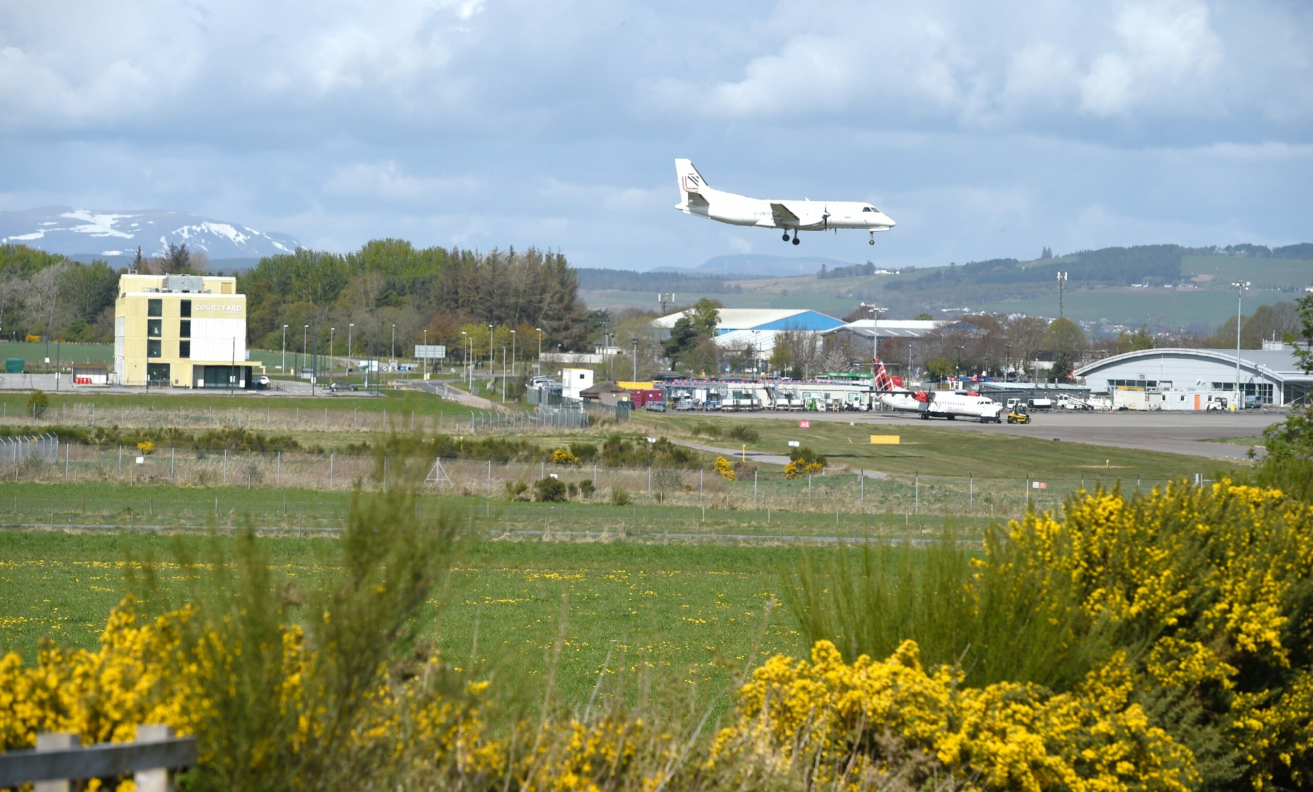 A Loganair flight lands at Inverness Airport. Picture by Sandy McCook