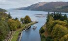 One of the Cruise Loch Ness vessels heads up the Caledonian Canal to the world-famous loch.