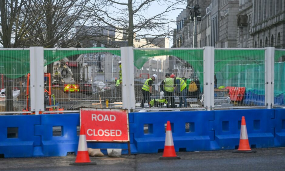 Work behind the hoarding in Union Terrace, as the gardens project nears completion. Picture by Scott Baxter/DCT Media.