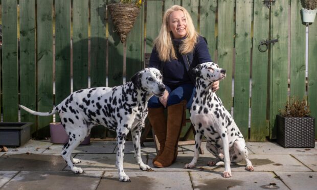 Julie Hunt with two of her Dalmations.