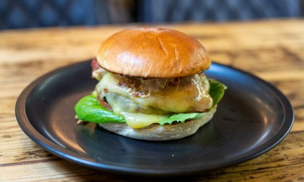 Bun in a million: Cafe 83's signature burger is hugely popular. Picture by Scott Baxter.