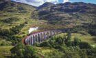 Glenfinnan Railway Viaduct in Scotland with the Jacobite steam train passing over. Picture by Shutterstock.