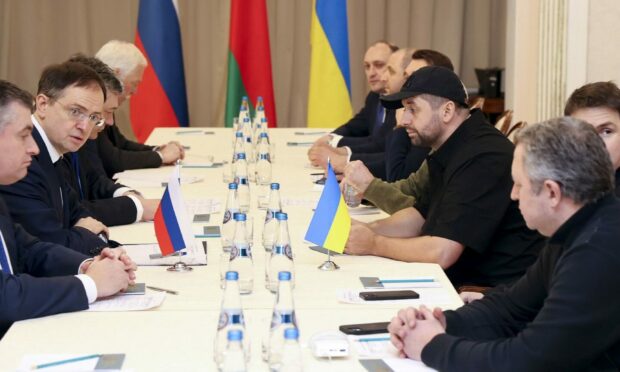 Vladimir Medinsky, the head of the Russian delegation, second left, and Davyd Arakhamia, faction leader of the Servant of the People party in the Ukrainian Parliament, third right, attend the peace talks in Gomel region, Belarus. Picture by Sergei Kholodilin/BelTA Pool Photo via AP.