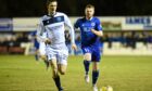Peterhead midfielder Alan Cook, right, in action against Dundee