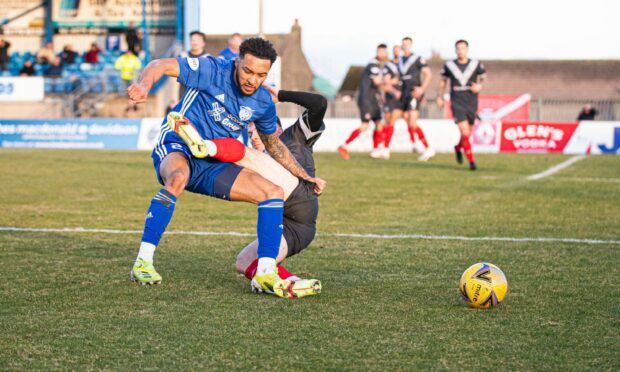 Peterhead's Rico Quitongo is challenged by Airdrie's Brody Paterson. Picture by Wullie Marr/DCT Media