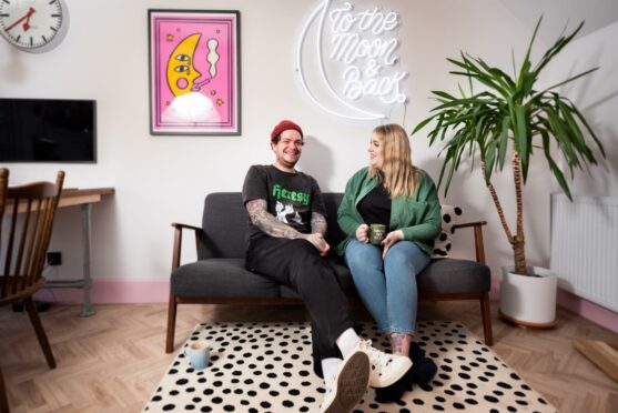 Couple sat in one of the new homes in Stonehaven.