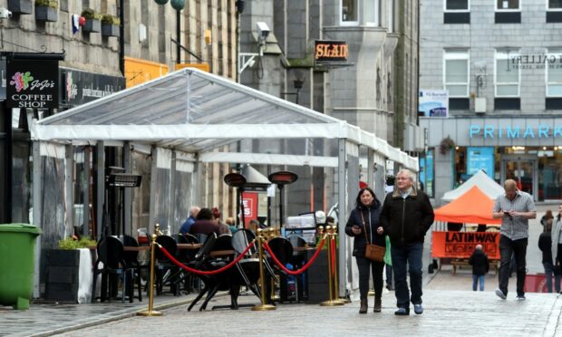 Businesses in Belmont Street embraced the relaxed rules during the pandemic, putting up tents and taking to the pavement. There are hopes a permanent cafe culture can comoe out of the disruption. Picture by Jim Irvine/DCT Media.