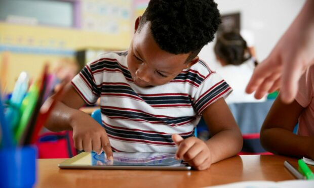 School pupil using a tablet