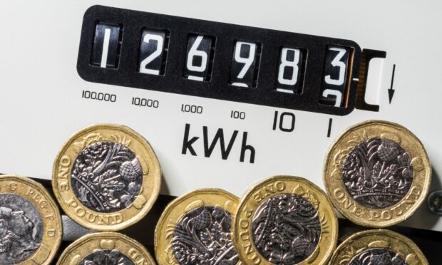 Energy meter with pound coins.