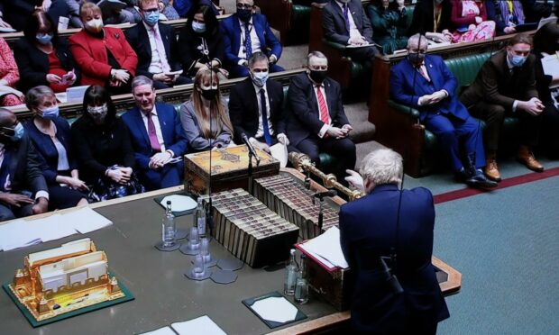 Prime Minister Boris Johnson points at Labour leader Keir Starmer during Prime Minister's Questions. 
 Hugo Philpott/UPI/Shutterstock