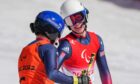 Neil Simpson (R) and his guide Andrew Simpson celebrate during the Para Alpine Skiing men's Super-G.