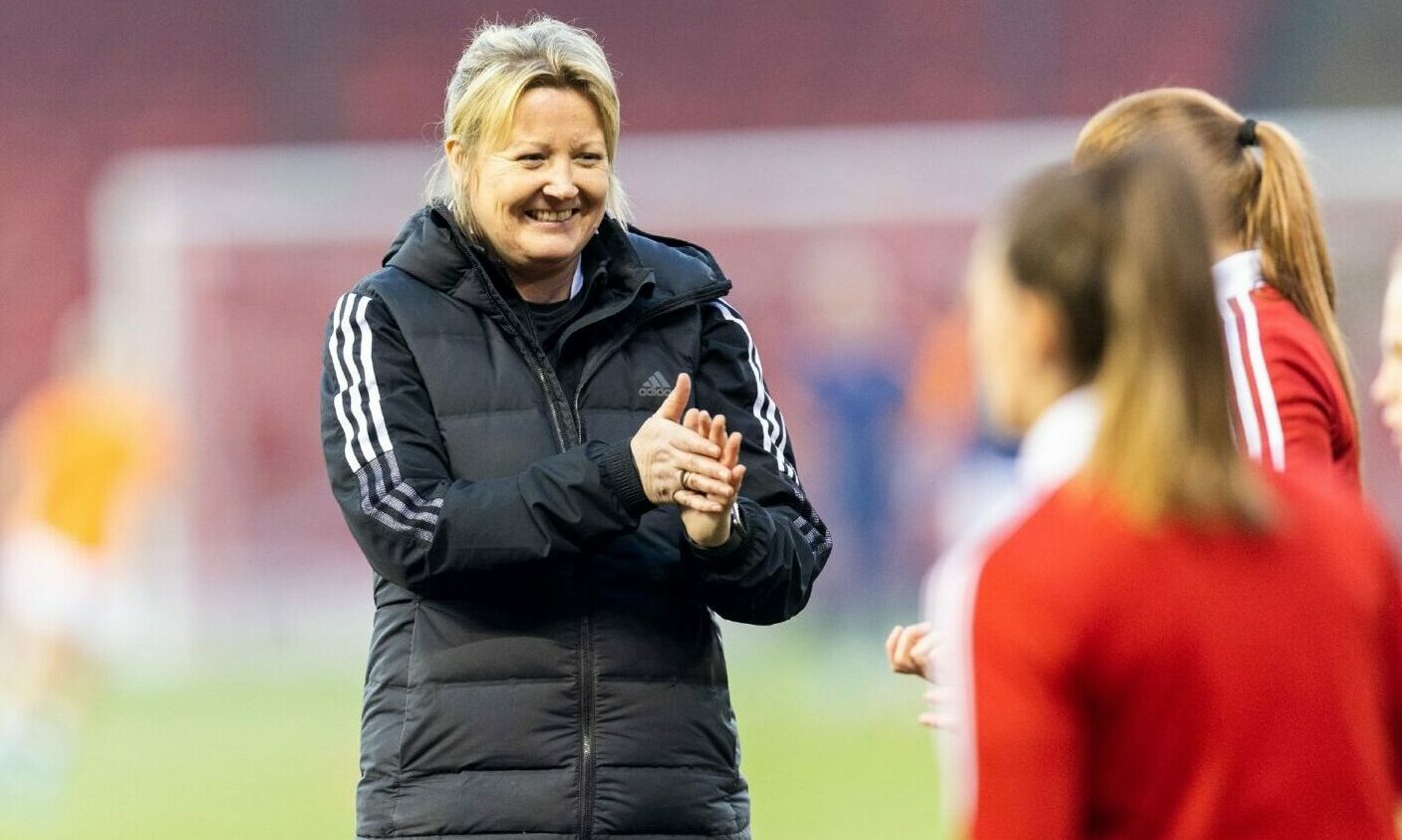 Aberdeen Women co-manager Emma Hunter smiling at her players.
