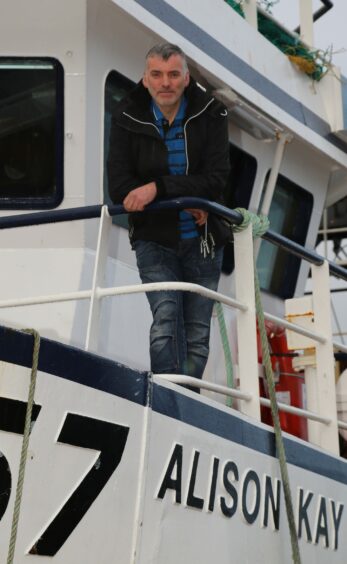 Shetland fishing skipper on boat deck