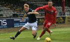 Dundee's Max Anderson and St Mirren's Charles Dunne in action.