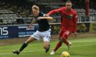 Dundee's Max Anderson and St Mirren's Charles Dunne (left) in action.