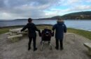 carers in Scotland admiring the view on a walk