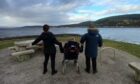 carers in Scotland admiring the view on a walk