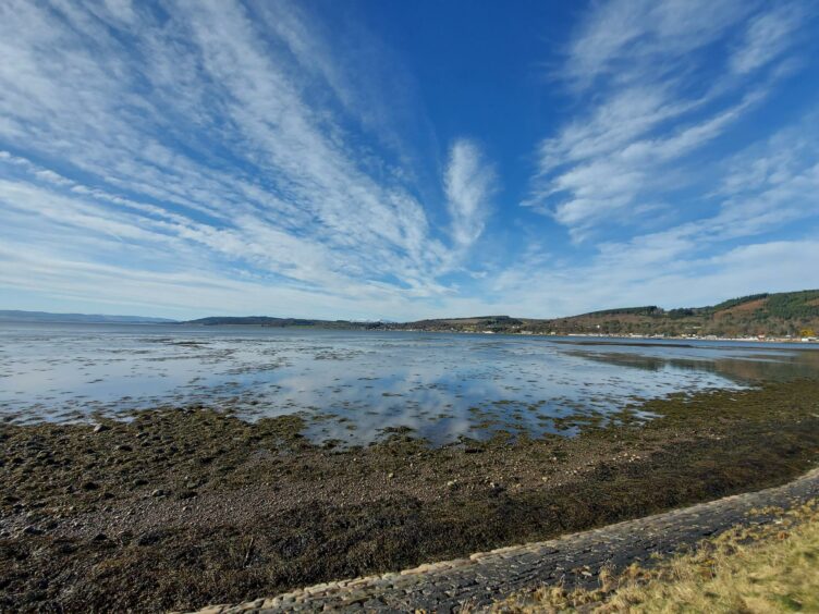 A blue sky with white clouds on the river front in Aberdeen.